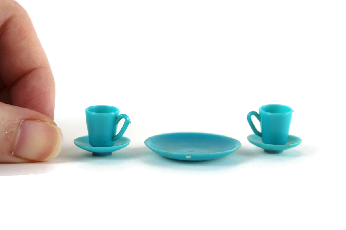 http://themustarddandelion.com/cdn/shop/products/BluePlasticDollhouseTeacupSaucerPlateSet_3_1200x1200.jpg?v=1657589845