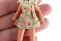 Vintage 1:12 Dollhouse Plastic Girl Daughter Figurine in Beige Leaf Print Dress with Jointed Arms & Legs
