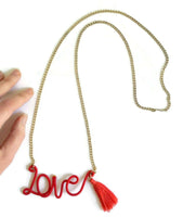 Rare Anthropologie "Thread-Wrapped Sentiment Necklace" Orange Script Love Necklace